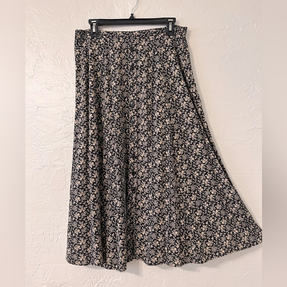 SOLD. Black Skirt, nude flower print. Flattering, nice fall to it.